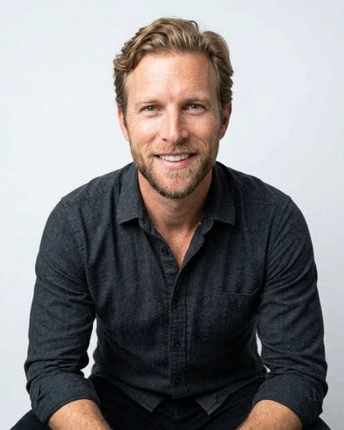 Soft White to Light Grey Studio · Charcoal Button-Up with Dark Pants headshot example