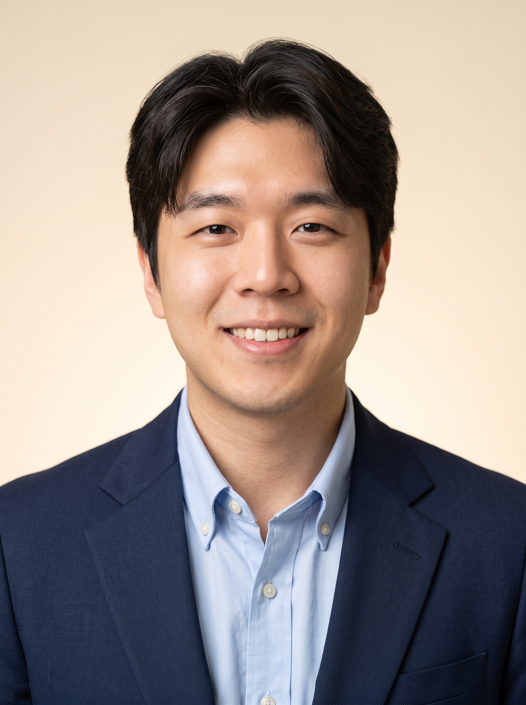 Warm Studio · Navy Blazer headshot example