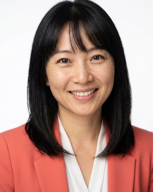 White / Pure White Studio · Coral blazer over white blouse headshot example