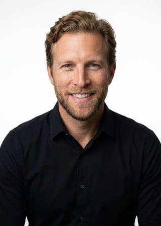 Professional AI LinkedIn headshot in Black long-sleeve button-up on White / Pure White Studio