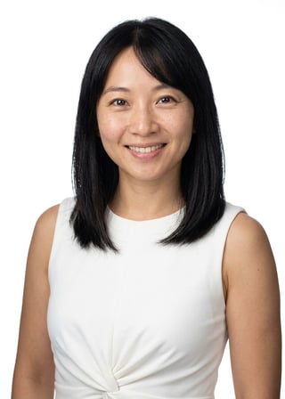 Professional AI LinkedIn headshot in White twist-waist sleeveless dress on White / Pure White Studio