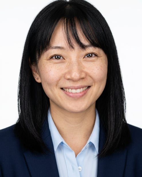 White / Pure White Studio · Navy blazer with light blue shirt headshot example