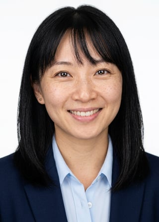 Professional AI LinkedIn headshot in Navy blazer with light blue shirt on White / Pure White Studio