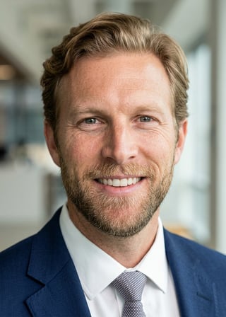 Professional AI LinkedIn headshot in Navy blazer with light blue shirt on Lobby (corporate lobby)