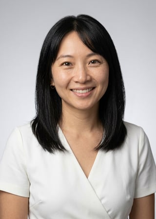 Professional AI LinkedIn headshot in White wrap dress on Neutral Gradient / Light Grey