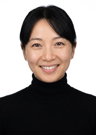 Professional AI LinkedIn headshot in Fitted black turtleneck (women's relaxed fit) on White / Pure White Studio