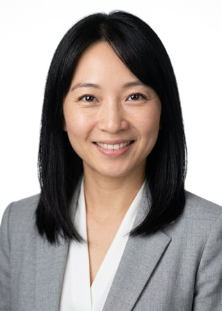 Professional AI LinkedIn headshot in Light gray blazer on White / Pure White Studio