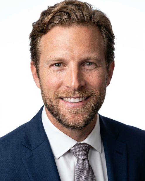 White / Pure White Studio · Dark blue tailored suit headshot example