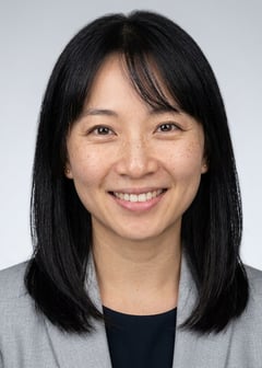 Professional AI LinkedIn headshot in Light gray blazer on Neutral Gradient / Light Grey