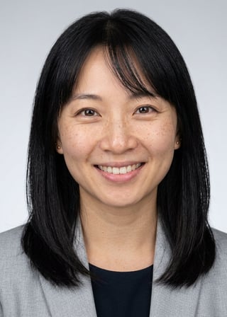 Professional AI LinkedIn headshot in Light gray blazer on Neutral Gradient / Light Grey
