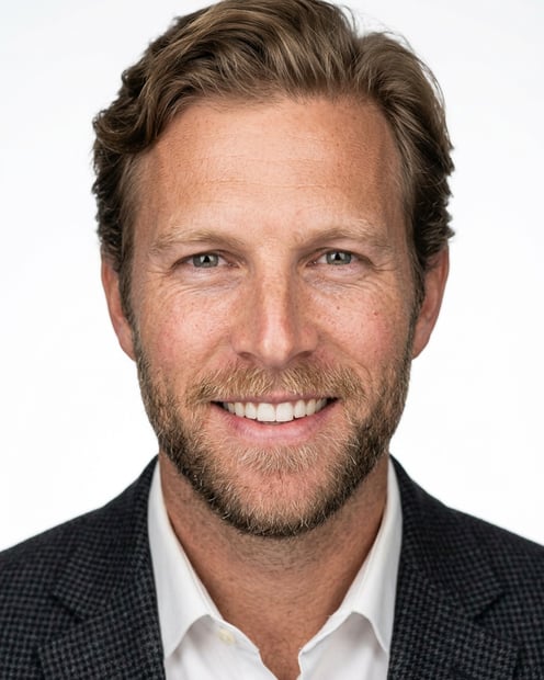 White / Pure White Studio · Dark gray patterned blazer headshot example