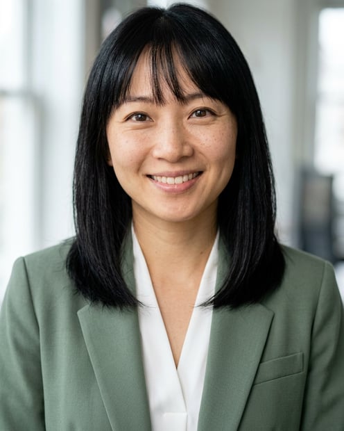 Office / Modern Office Workspace · Sage green blazer with white blouse headshot example