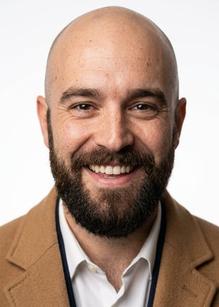 Professional AI LinkedIn headshot in Camel overcoat on White / Pure White Studio