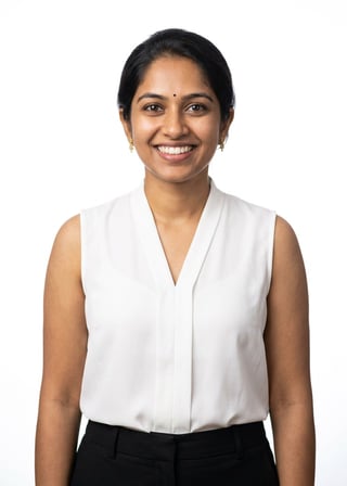 Professional AI LinkedIn headshot in Black tailored trousers + white blouse (sleeveless neckline) on White / Pure White Studio