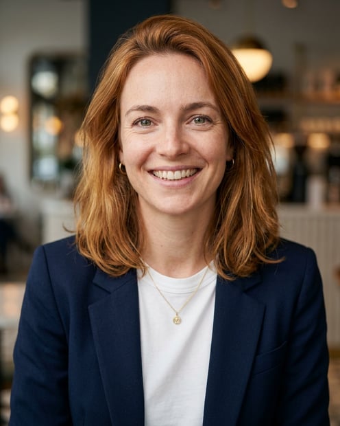 Cafe · Open navy blazer over simple white tee headshot example