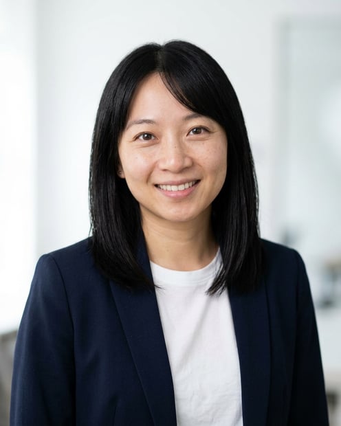 Office / Modern Office Workspace · Open navy blazer over simple white tee headshot example