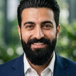 Professional AI LinkedIn headshot in Navy tailored suit on Garden / Lush Greenery