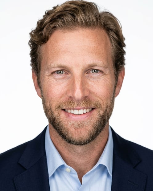 White / Pure White Studio · Navy blazer with light blue shirt headshot example