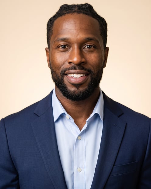 Warm Studio · Navy Blazer headshot example