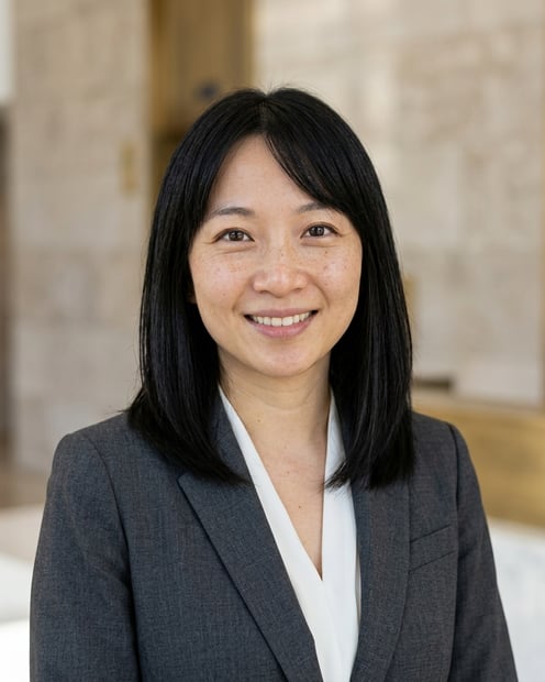 Bright Reception Wall · Soft Gray Suit headshot example