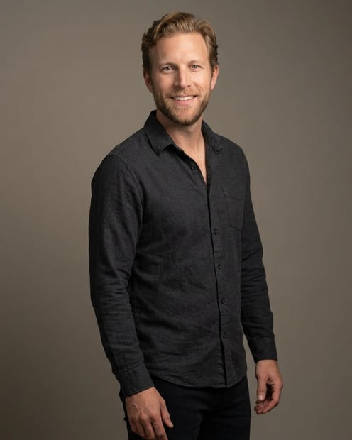 Warm Grey Studio Sweep · Charcoal Button-Up with Dark Pants headshot example