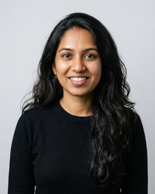 Soft White to Light Grey Studio · Black Long-Sleeve Knit Top headshot example
