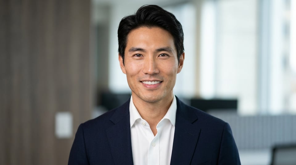 Professional AI LinkedIn headshot in White button-up shirt on Office / Modern Office Workspace
