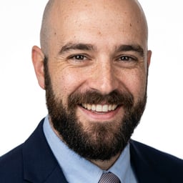 Professional AI LinkedIn headshot in Navy blazer with light blue shirt on White / Pure White Studio