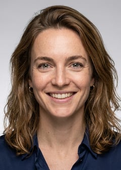 Professional AI LinkedIn headshot in Silk blouse trousers on Neutral Gradient / Light Grey
