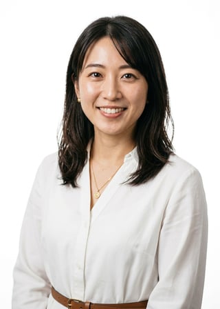 Professional AI LinkedIn headshot in White shirt dress with brown belt on White / Pure White Studio