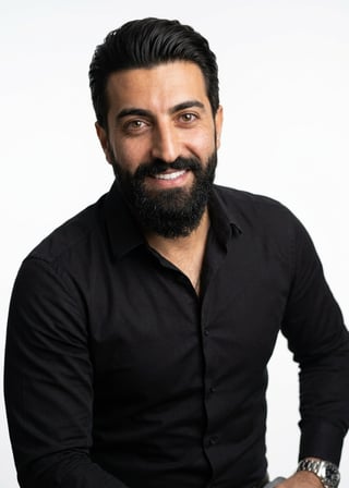 Professional AI LinkedIn headshot in Black long-sleeve button-up on White / Pure White Studio