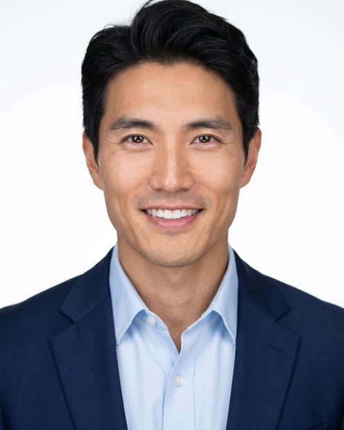 White / Pure White Studio · Navy blazer with light blue shirt headshot example