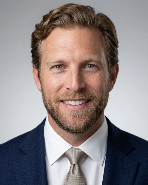 Light Grey Gradient Studio · Navy Suit with White Shirt headshot example