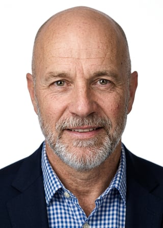 Professional AI LinkedIn headshot in Blue and white checked button-up on White / Pure White Studio