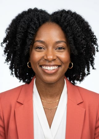 Professional AI LinkedIn headshot in Coral blazer over white blouse on White / Pure White Studio