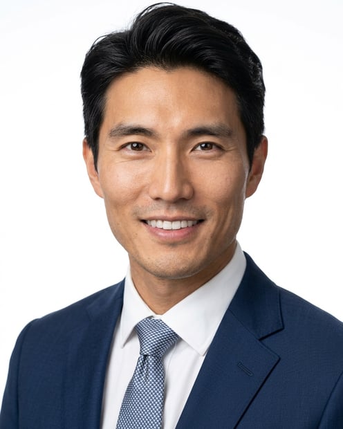 White / Pure White Studio · Dark blue tailored suit headshot example