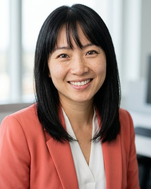 Office / Modern Office Workspace · Coral blazer over white blouse headshot example