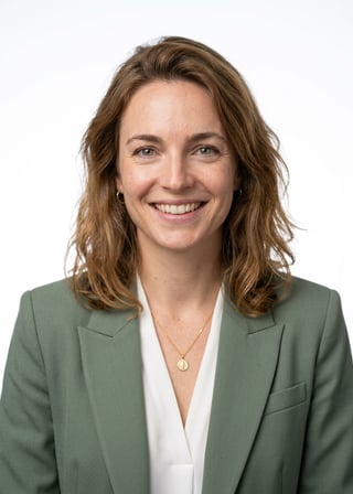 Professional AI LinkedIn headshot in Sage green blazer with white blouse (2026 trend) on White / Pure White Studio