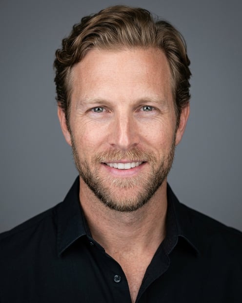 Neutral Mid-Grey Gradient Seamless · Black Button-Up with Dark Trousers headshot example