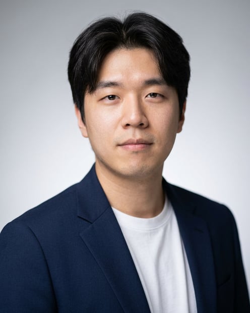 Neutral Gradient / Light Grey · Open navy blazer over simple white tee headshot example