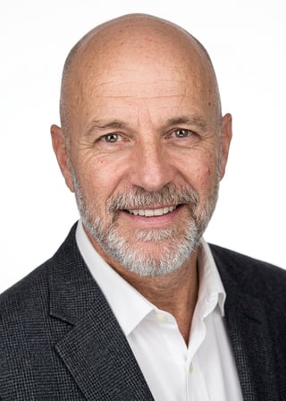 Professional AI LinkedIn headshot in Dark gray patterned blazer on White / Pure White Studio