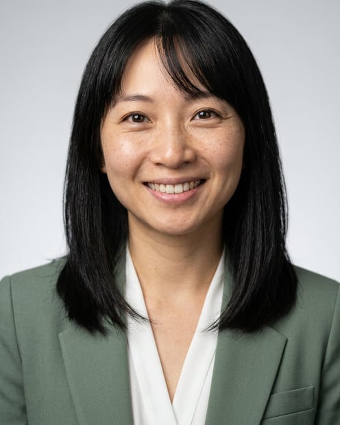 Neutral Gradient / Light Grey · Sage green blazer with white blouse headshot example