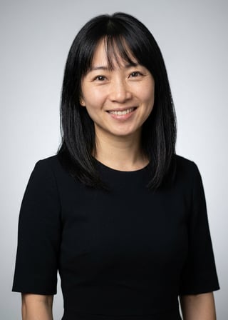 Professional AI LinkedIn headshot in Black midi fitted dress on Neutral Gradient / Light Grey