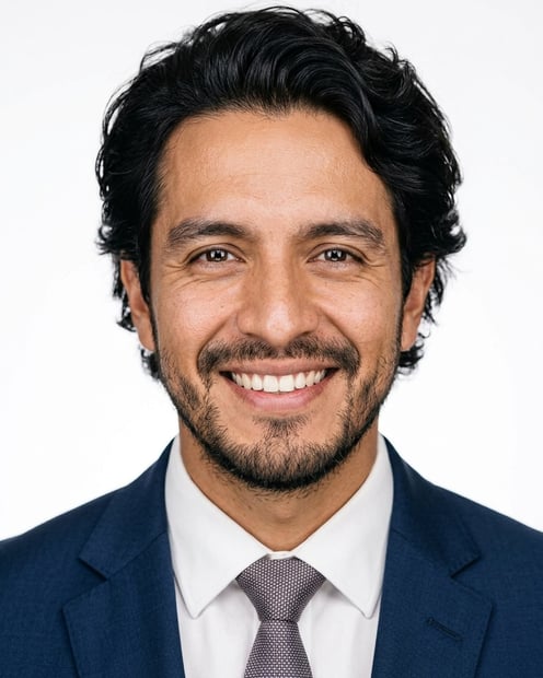 White / Pure White Studio · Dark blue tailored suit headshot example