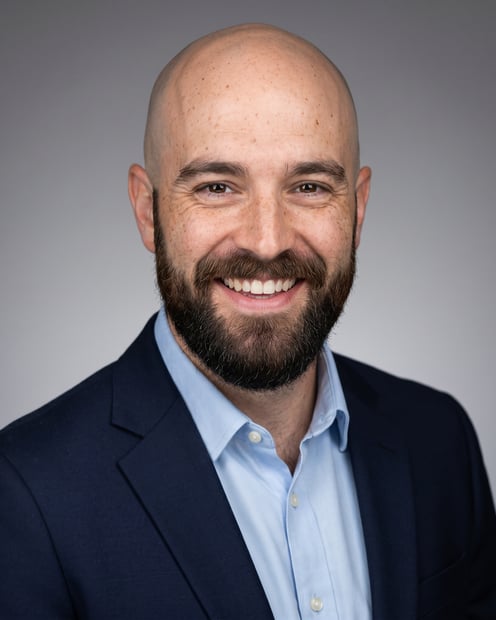 Neutral Gradient / Light Grey · Navy blazer with light blue shirt headshot example