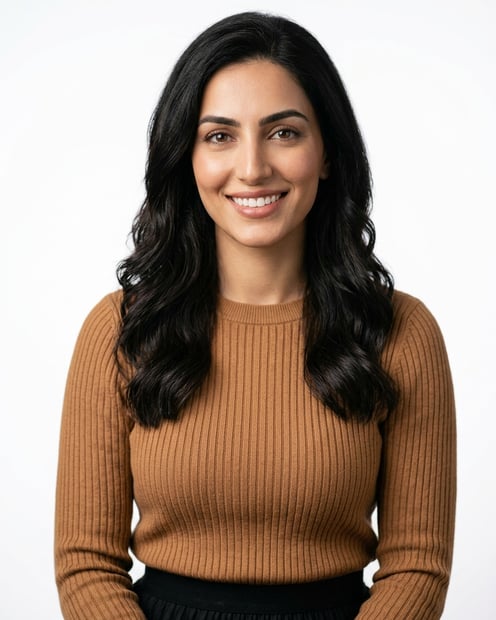 White / Pure White Studio · Caramel ribbed knit sweater + black pleated skirt headshot example