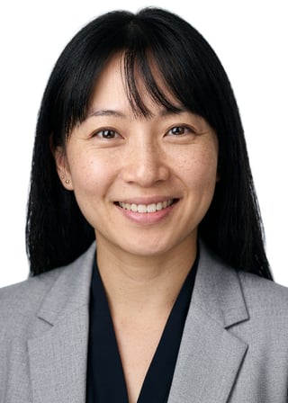 Professional AI LinkedIn headshot in Light gray blazer on White / Pure White Studio