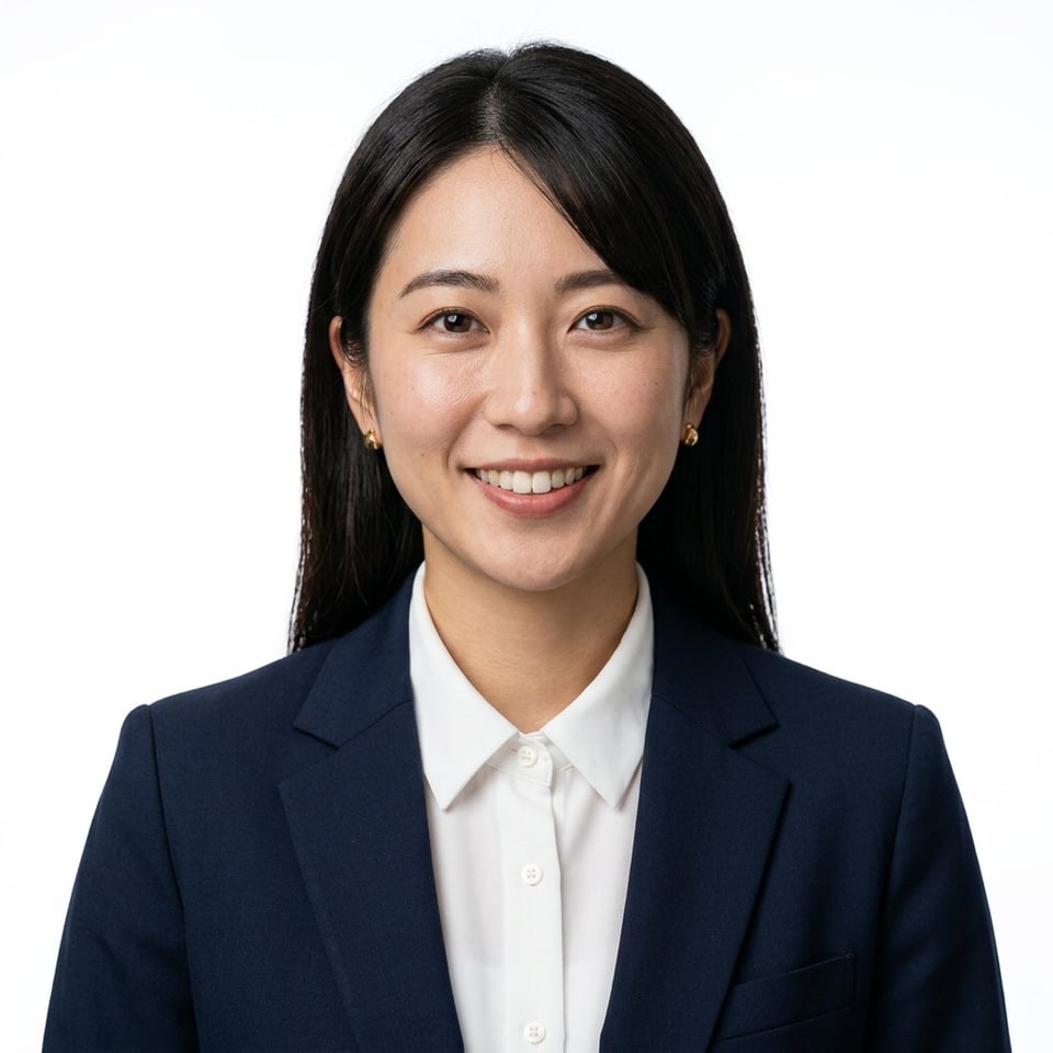 Professional AI LinkedIn headshot in Navy Blazer, Coral Blouse on White / Pure White Studio