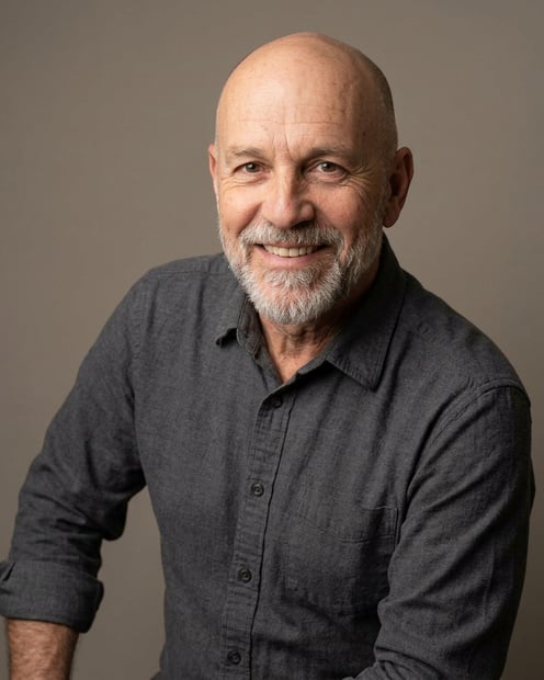 Warm Grey Studio Sweep · Charcoal Button-Up with Rolled Sleeves headshot example