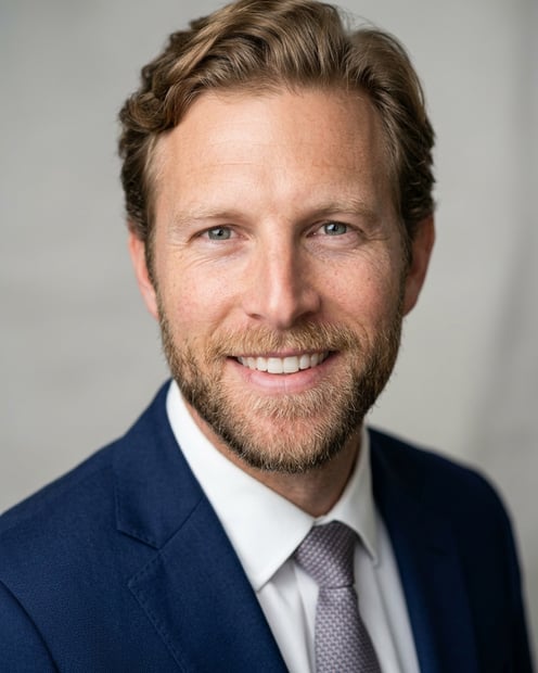 Neutral Gradient / Light Grey · Navy blazer with light blue shirt headshot example